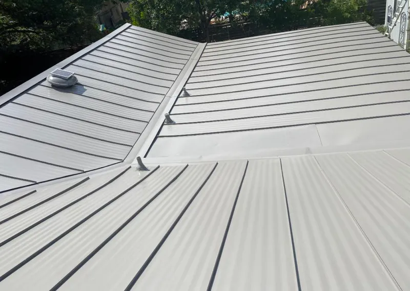 Solar attic fan installed on a metal roof for Roof Ventilation in Beaufort